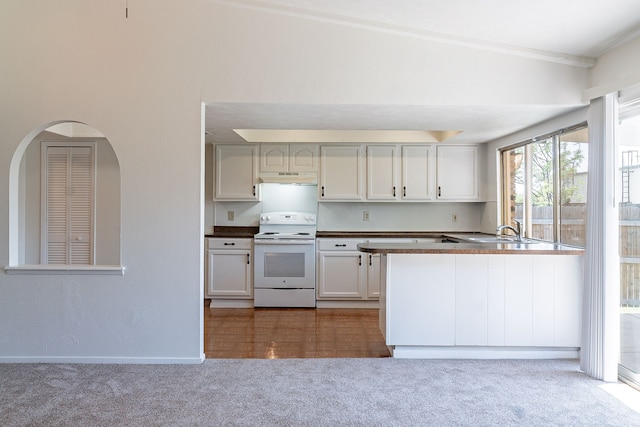 kitchen with white electric range, carpet, under cabinet range hood, dark countertops, and a sink
