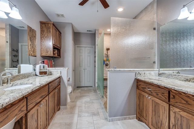 900 Crest Ridge Ct, Irving, TX 75061 - bathroom with a stall shower, a ceiling fan, vanity, and toilet