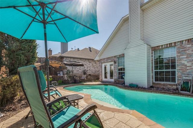 900 Crest Ridge Ct, Irving, TX 75061 - swimming pool with french doors and a patio area