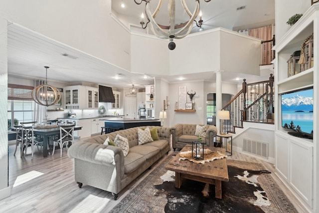 389 Meadow Hill Rd, Fort Worth, TX 76108 - living area with a chandelier, light wood-style floors, stairs, recessed lighting, and a towering ceiling