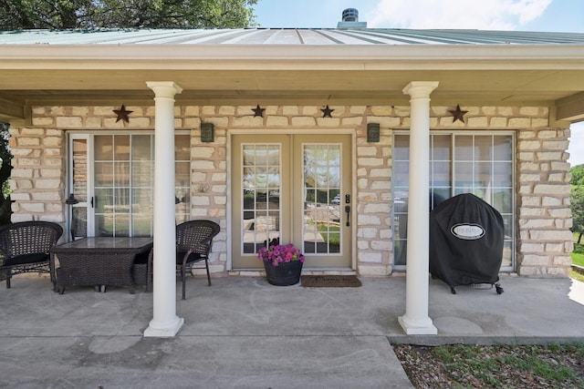 389 Meadow Hill Rd, Fort Worth, TX 76108 - doorway to property with stone siding, ceiling fan, and metal roof