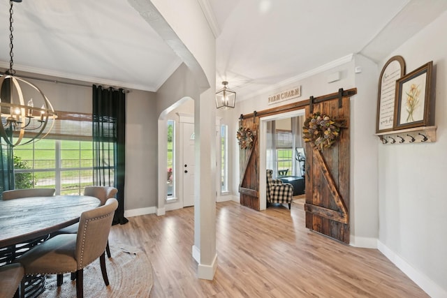 389 Meadow Hill Rd, Fort Worth, TX 76108 - entryway featuring a chandelier, a barn door, crown molding, arched walkways, and baseboards