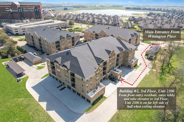 1735 Wittington Pl Unit 2306, Farmers Branch, TX 75234 - drone / aerial view featuring a water view