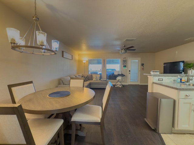 5828 Giddyup Ln, Fort Worth, TX 76179 - dining room featuring visible vents, wood finished floors, and ceiling fan with notable chandelier