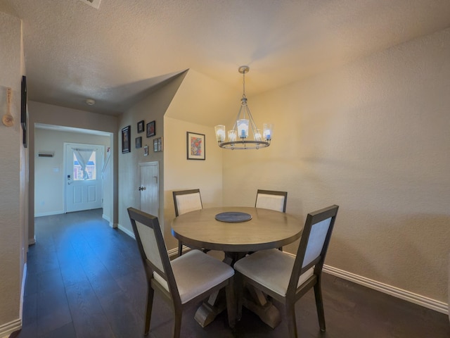5828 Giddyup Ln, Fort Worth, TX 76179 - dining room featuring a chandelier, a textured ceiling, baseboards, and dark wood-style flooring