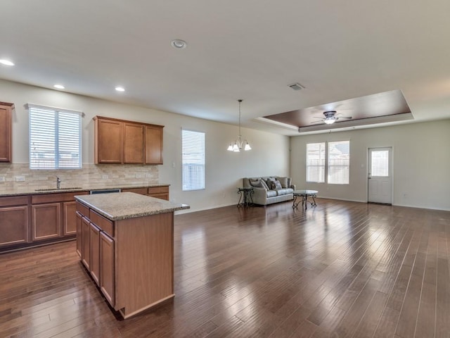 2232 Heaton St, Forney, TX 75126 - kitchen featuring open floor plan, a tray ceiling, a sink, healthy amount of natural light, and recessed lighting