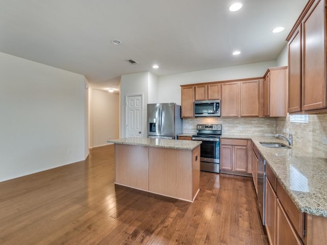 2232 Heaton St, Forney, TX 75126 - kitchen featuring stainless steel appliances, a sink, a kitchen island, tasteful backsplash, and recessed lighting