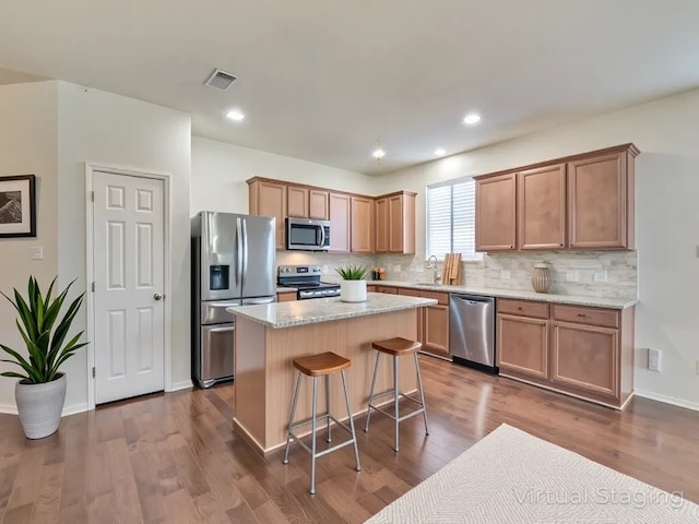 2232 Heaton St, Forney, TX 75126 - kitchen with stainless steel appliances, a sink, backsplash, a kitchen island, and dark wood-type flooring