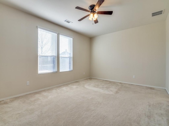 2232 Heaton St, Forney, TX 75126 - spare room featuring a ceiling fan, light colored carpet, and baseboards
