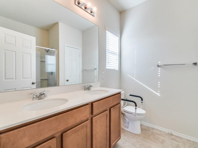 2232 Heaton St, Forney, TX 75126 - bathroom with double vanity, a shower stall, toilet, and baseboards