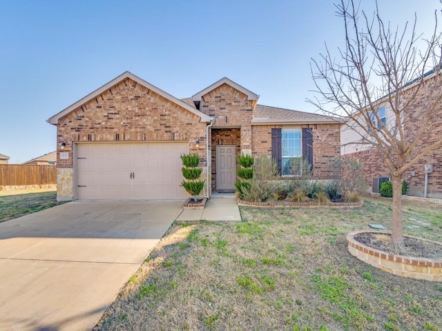 2232 Heaton St, Forney, TX 75126 - view of front facade with brick siding, an attached garage, and concrete driveway