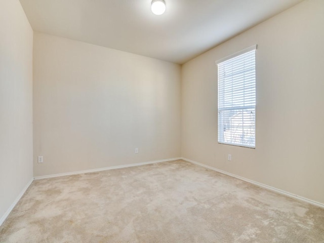 2232 Heaton St, Forney, TX 75126 - empty room with healthy amount of natural light, light carpet, and baseboards