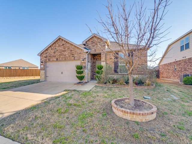 2232 Heaton St, Forney, TX 75126 - traditional-style house with brick siding, central AC, an attached garage, and driveway