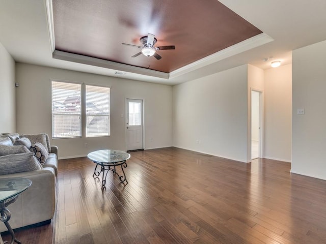 2232 Heaton St, Forney, TX 75126 - living room featuring a tray ceiling, ceiling fan, wood finished floors, and baseboards