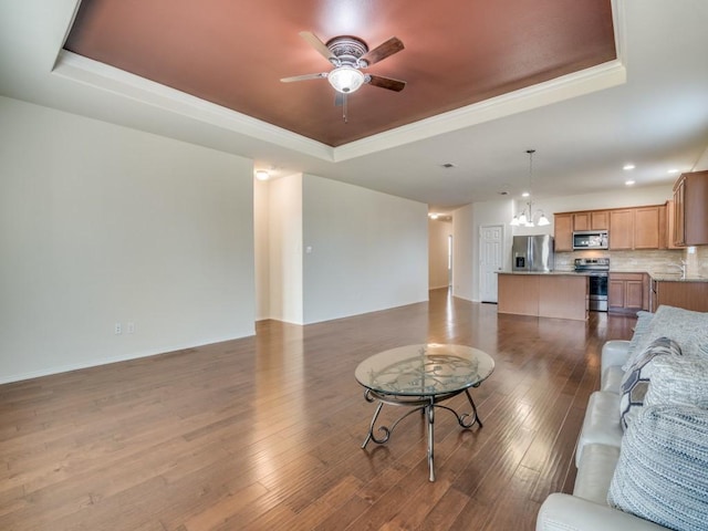 2232 Heaton St, Forney, TX 75126 - living area featuring a raised ceiling, a ceiling fan, dark wood-style flooring, recessed lighting, and a chandelier