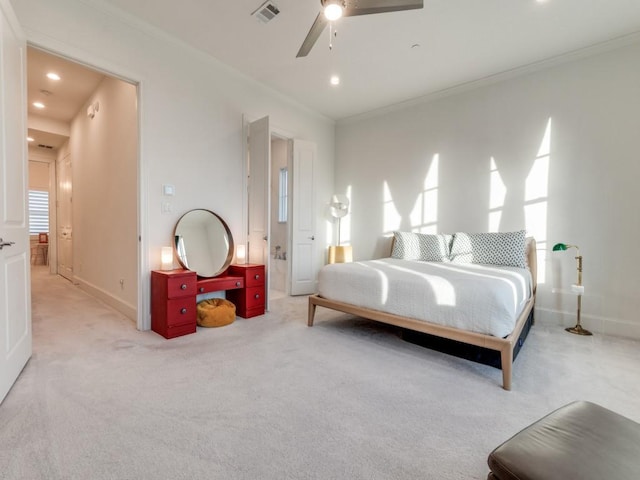 carpeted bedroom with baseboards, visible vents, and ornamental molding