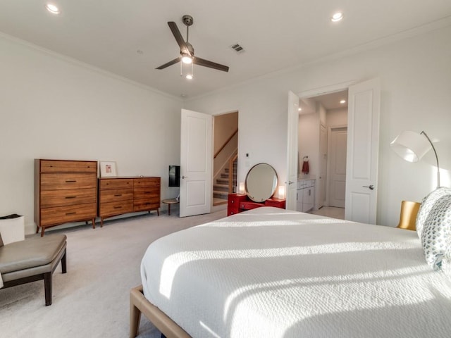 bedroom featuring ornamental molding, recessed lighting, visible vents, and light carpet