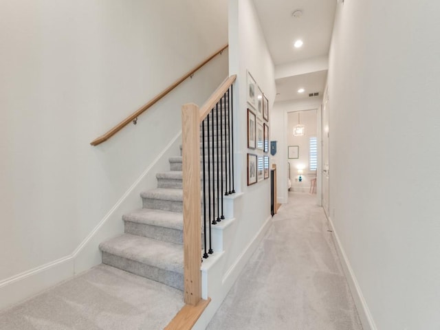 stairway featuring recessed lighting, baseboards, carpet floors, and visible vents