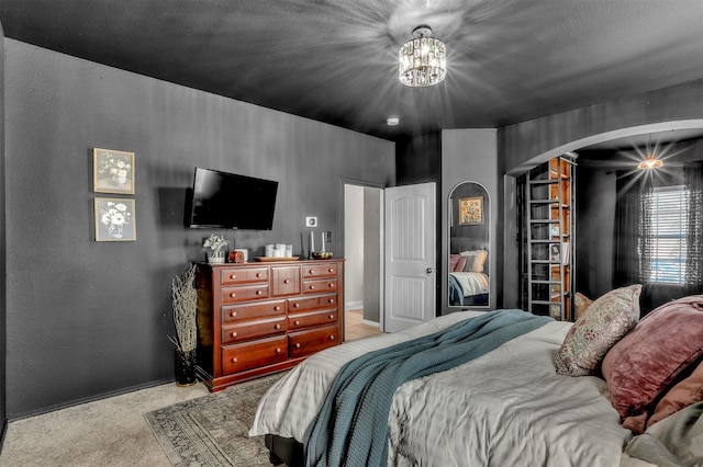 1380 Levi Ln, Forney, TX 75126 - carpeted bedroom featuring arched walkways and a notable chandelier