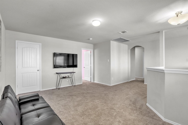 1380 Levi Ln, Forney, TX 75126 - unfurnished living room featuring baseboards, visible vents, arched walkways, and carpet floors