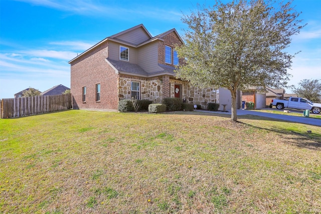 1380 Levi Ln, Forney, TX 75126 - traditional-style house with driveway, stone siding, fence, a front yard, and brick siding