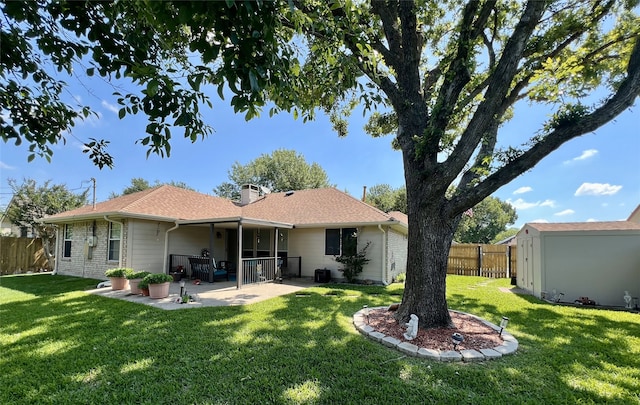 510 Canary Ln, Red Oak, TX 75154 - rear view of house with a patio, a chimney, an outbuilding, and a storage shed
