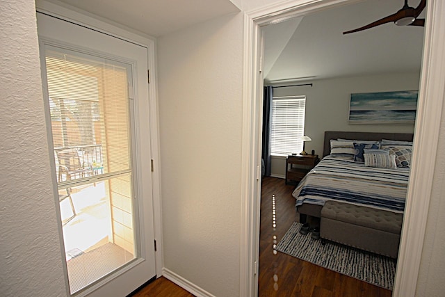 510 Canary Ln, Red Oak, TX 75154 - bedroom featuring wood finished floors, baseboards, a ceiling fan, and a textured wall