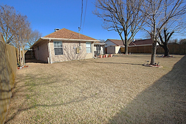 510 Canary Ln, Red Oak, TX 75154 - back of house featuring brick siding and a shingled roof