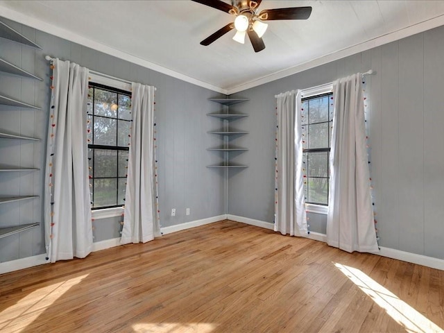 1402 Murphy Ave, Lufkin, TX 75904 - unfurnished room with ornamental molding, wood-type flooring, a ceiling fan, baseboards, and built in features