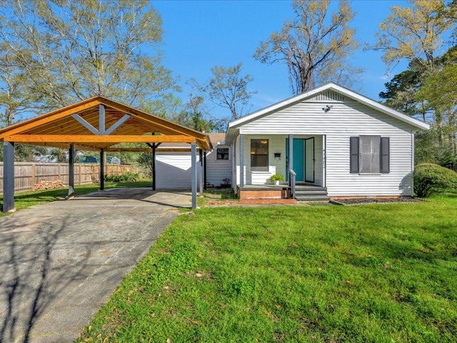 1402 Murphy Ave, Lufkin, TX 75904 - view of front of house with a carport, driveway, and covered porch