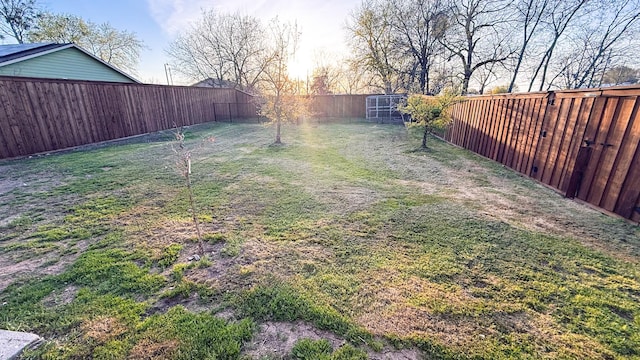 view of yard featuring a fenced backyard
