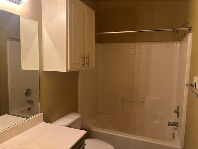 bathroom with toilet, shower / washtub combination, and vanity