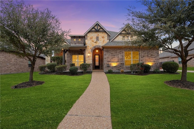 2313 Therese Dr, Waco, TX 76712 - french country style house featuring a yard, brick siding, and stone siding