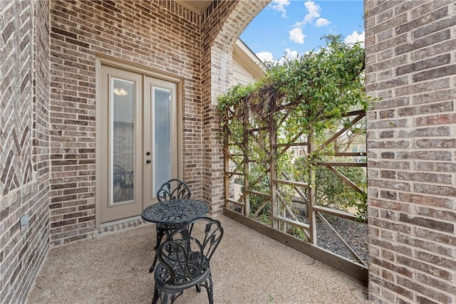 2313 Therese Dr, Waco, TX 76712 - property entrance with brick siding, a gate, and a patio area