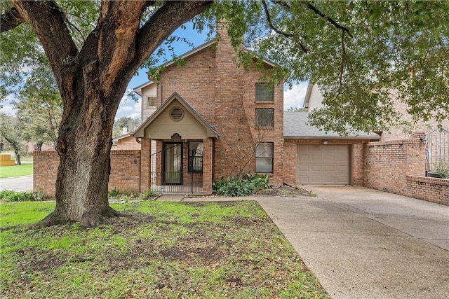 125 Pleasant Grove Ln, Waco, TX 76712 - traditional home with brick siding, a chimney, concrete driveway, and an attached garage
