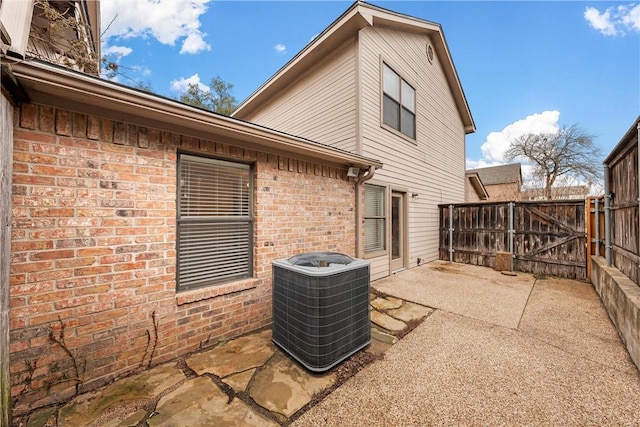 125 Pleasant Grove Ln, Waco, TX 76712 - view of patio featuring a gate, central AC unit, and fence