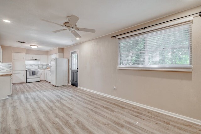 102 E Robertson Ave, Copperas Cove, TX 76522 - unfurnished living room with ceiling fan, baseboards, and light wood-style flooring