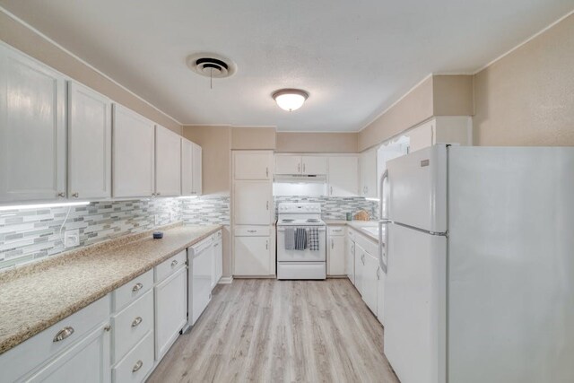 102 E Robertson Ave, Copperas Cove, TX 76522 - kitchen with decorative backsplash, white cabinetry, white appliances, and light wood-style flooring