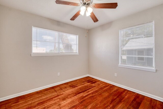 102 E Robertson Ave, Copperas Cove, TX 76522 - unfurnished room featuring wood finished floors, baseboards, and a ceiling fan