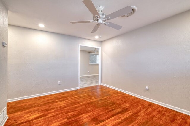 102 E Robertson Ave, Copperas Cove, TX 76522 - unfurnished room with baseboards, a ceiling fan, wood finished floors, and recessed lighting