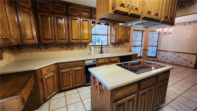 kitchen featuring light tile patterned flooring, black appliances, light countertops, and a sink