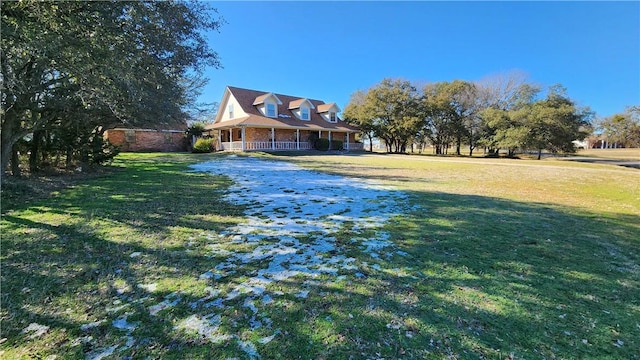 view of yard with covered porch