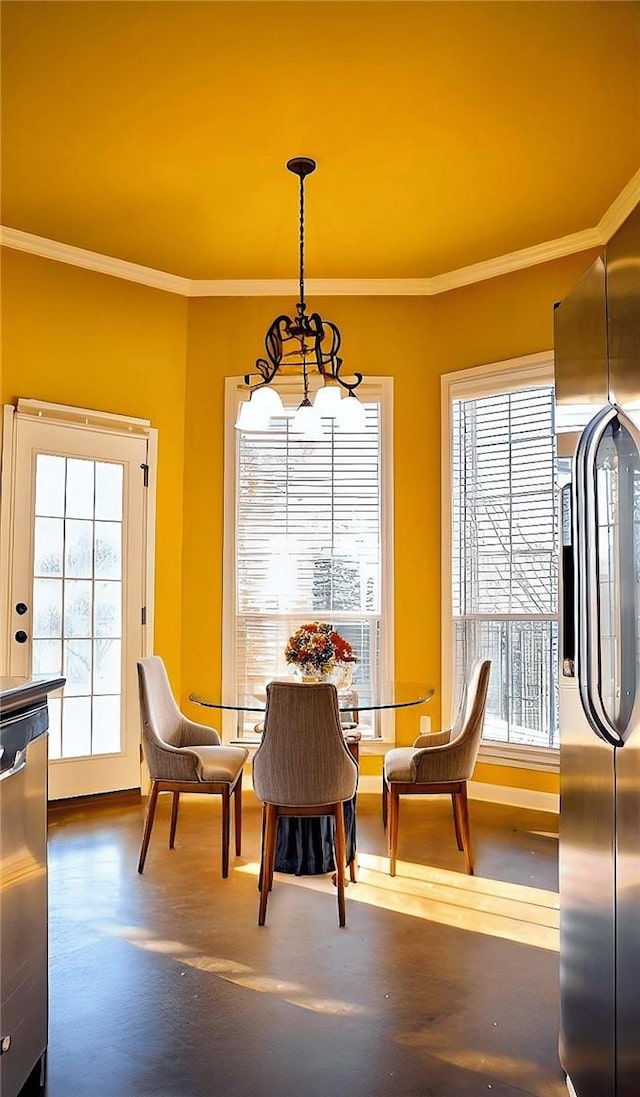 dining space featuring an inviting chandelier and crown molding