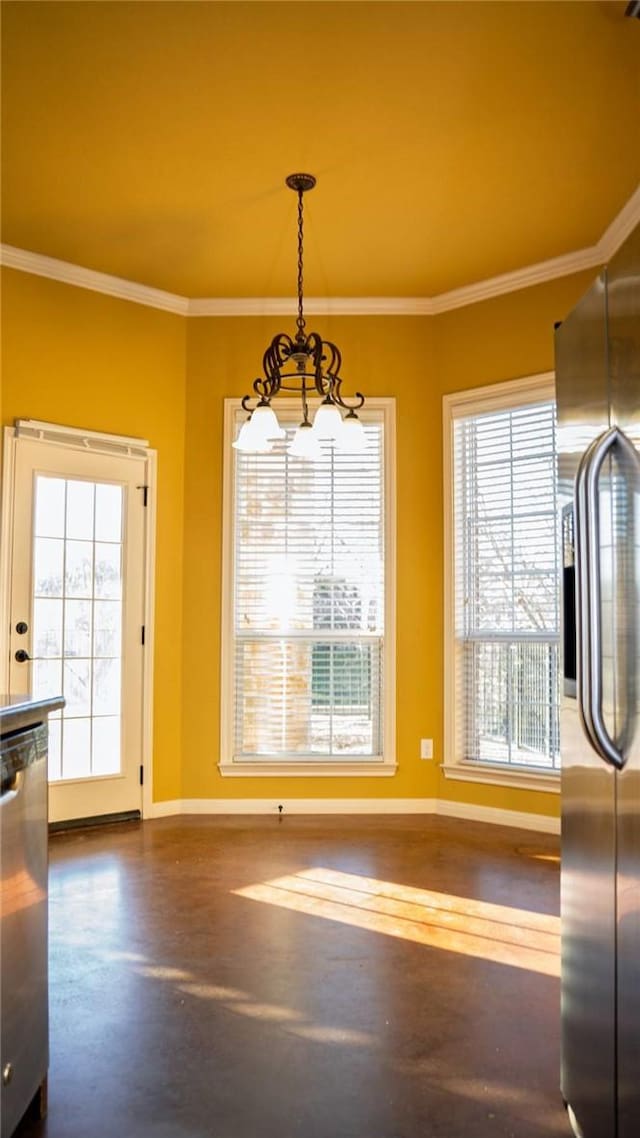 unfurnished dining area with a notable chandelier, concrete flooring, crown molding, and baseboards