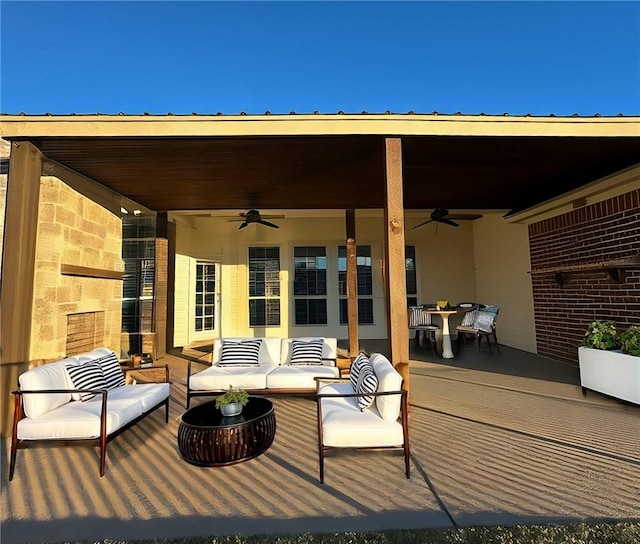 wooden terrace featuring outdoor dining space, an outdoor living space, a patio, and a ceiling fan