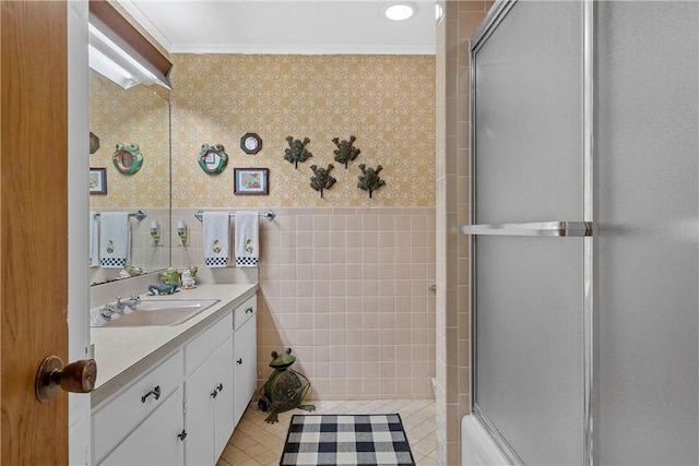 2522 S Robinson Dr, Robinson, TX 76706 - bathroom with a shower with door, wainscoting, wallpapered walls, and crown molding