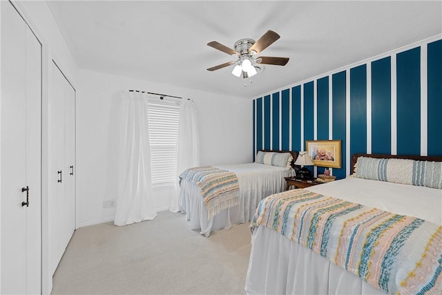 2522 S Robinson Dr, Robinson, TX 76706 - carpeted bedroom featuring wallpapered walls, an accent wall, baseboards, a closet, and a ceiling fan