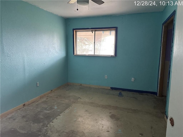 unfurnished room with baseboards and a ceiling fan