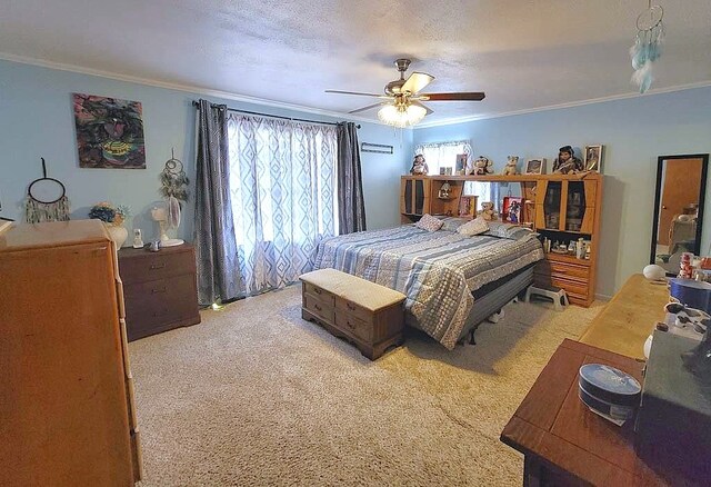 3833 Huaco Ln, Waco, TX 76710 - bedroom featuring crown molding, light carpet, and a ceiling fan