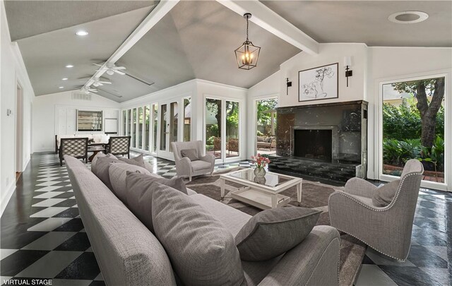 3720 Herwol Ave, Waco, TX 76710 - living room with lofted ceiling with beams, a healthy amount of sunlight, recessed lighting, and a fireplace